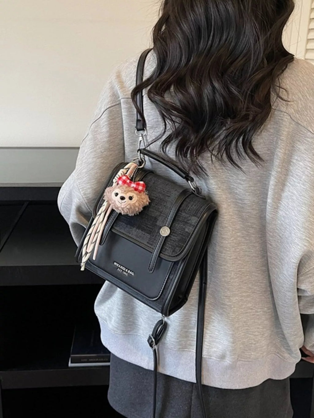Flap Backpack Bag with Plush Charm in Black for Women